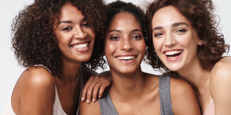 three smiling women