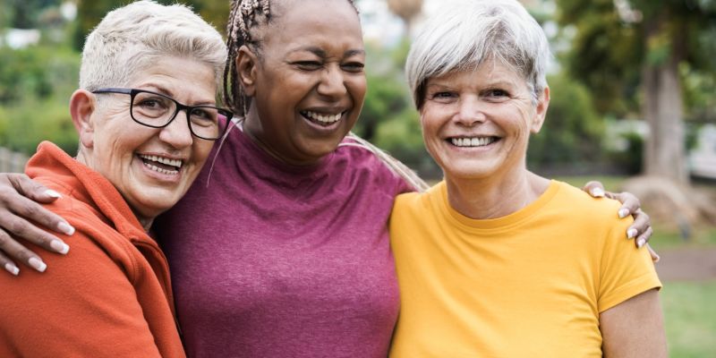 three older women smiling