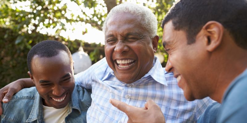 three older men smiling