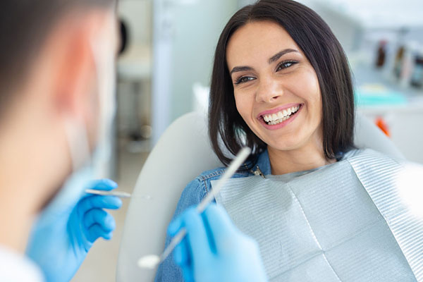woman sitting in the dental chair and smiling