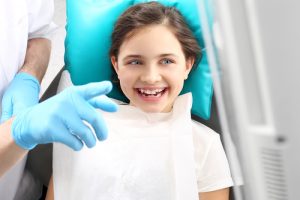 young girl at dentist office