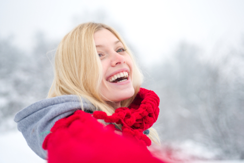 woman smiling in winter snow