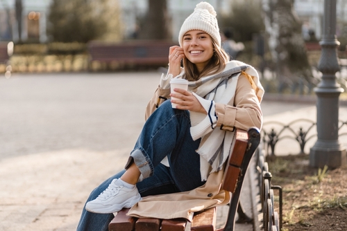woman sitting on park bench