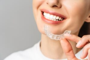 Young,Woman,Does,A,Home,Teeth,Whitening,Procedure